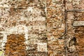 Old brick wall with traces of old restoration and reconstruction of the house. Royalty Free Stock Photo