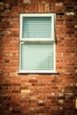 Old brick wall with window blinds Royalty Free Stock Photo