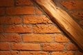 Old brick wall with wooden joist