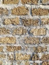 Old brick yellow background texture. Porous brick wall in temple