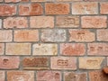 The old bricks wall build from branded bricks. An amazing collection