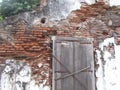 Old brick wall damage and dirty and old window