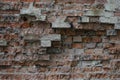 Old brickwork. A fragment of a collapsing wall. Textured background image. Color frame