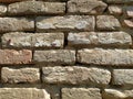 Old brickwork. Wall of an old residential building. Brick wall made of bright red bricks. Lightly worn surface. Neat masonry Royalty Free Stock Photo