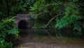 Old bridge across the Frame river in a small town in Dorset, UK