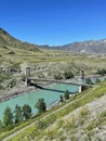 Old bridge across the Katun river in the Inya village, Altai, Russia