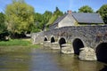 Old bridge at AsniÃÂ¨res sur ViÃÂ¨gre in France Royalty Free Stock Photo