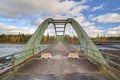 Old bridge crossing Pite river at Ljusselforsen in Lapland