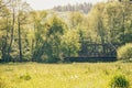 Dreamlike natural landscape in the sunshine with an old railway bridge