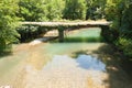 Old bridge over mountain river Royalty Free Stock Photo