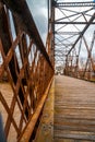 Old bridge in rusty metal structure and wooden floor of Saint-Pie, Quebec