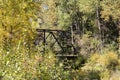 Old bridge spans over small creek in rural Colorado Royalty Free Stock Photo