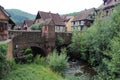 old bridge and weiss river in a village (kaysersberg) in alsace (france) Royalty Free Stock Photo