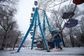 Old bright ferris wheel in an amusement park on a winter day Royalty Free Stock Photo