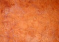 Old bright orange brown painted faded stained cracked rough plaster wall background