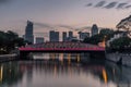 Old brightly illuminated bridge on the Singapore river at sunrise - 4