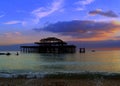 Old Brighton Pier sunset, England landscape Royalty Free Stock Photo