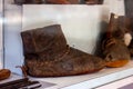 Old broken ancient handmade leather shoes from archaeological excavations.