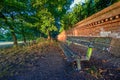 A old and broken bench in Harvington Park, Beckenham, Kent at sunset Royalty Free Stock Photo