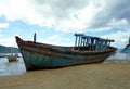 Old broken boat on the coast. Royalty Free Stock Photo