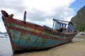 Old broken boat on the coast. Royalty Free Stock Photo