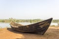 Old broken boat on the shore against the backdrop of the river and the green jungle Royalty Free Stock Photo