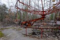 An old broken carousel in the abandoned city of Pripyat. Abandoned amusement park Royalty Free Stock Photo