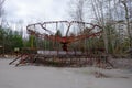 An old broken carousel in the abandoned city of Pripyat. Abandoned amusement park Royalty Free Stock Photo