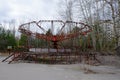 An old broken carousel in the abandoned city of Pripyat. Abandoned amusement park Royalty Free Stock Photo