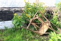 Old broken chair lying near the wall of the house Royalty Free Stock Photo