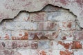 Old broken damaged plastered red brick wall background texture. space for text