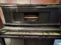 Old broken dirty piano destroyed out of service