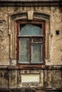 Old broken dirty window in the old house. Window in abandoned old house.