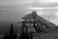 Old broken down wooden pier in Punta Arenas, old dock in Chile o Royalty Free Stock Photo