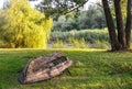 Old broken fishing boat by the river. Riverside