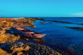 Old broken fishing boat on the shore