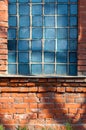 Old broken glass blocks in the brick walls Royalty Free Stock Photo