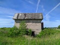 old and broken house made of white bricks on a blue sky background Royalty Free Stock Photo