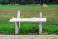 Old and broken long white cement bench for relaxing after the exercise beside the exercise yard Royalty Free Stock Photo