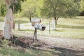 Old broken mailbox in a rural field Royalty Free Stock Photo