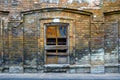 The old broken nailed-up window on the brick wall Royalty Free Stock Photo