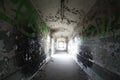 Old broken passage tunnel with light at the end, photographed with Wide-angle lens Royalty Free Stock Photo