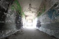 Old broken passage tunnel with light at the end, photographed with Wide-angle lens Royalty Free Stock Photo