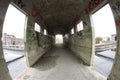 Old broken passage tunnel with light at the end, photographed with Wide-angle lens Royalty Free Stock Photo