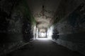 Old broken passage tunnel with light at the end, photographed with Wide-angle lens Royalty Free Stock Photo