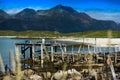 Old broken pier with misc stuff landscape background