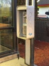 Old broken public pay phone