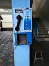 old broken public telephone in school