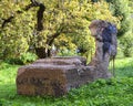 Old broken reinforced concrete slab in a green garden Royalty Free Stock Photo