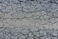 old broken road with cracked asphalt . Royalty Free Stock Photo